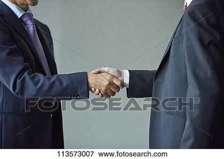 Stock Photo - Japanese businesspeople in a meeting. Fotosearch