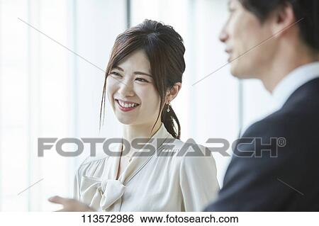 Japanese businesspeople in a meeting View Large Photo Image Stock Photograph - Japanese businesspeople in a meeting. Fotosearch