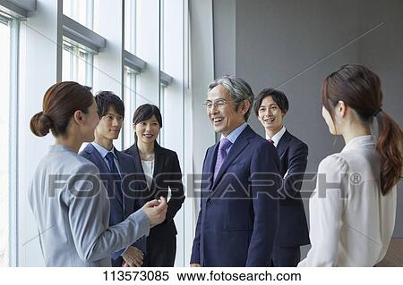 Japanese businesspeople in a meeting View Large Photo Image Stock Photography - Japanese businesspeople in a meeting. Fotosearch