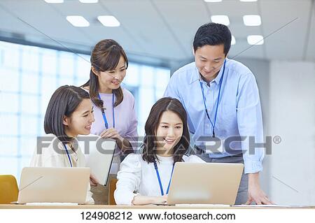 Japanese businesspeople in the office View Large Photo Image Stock Image - Japanese businesspeople in the office. Fotosearch