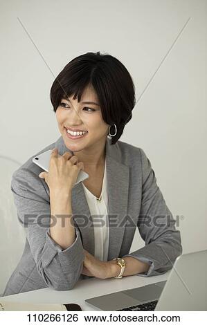 Stock Photograph - Japanese businesswoman in the office. Fotosearch