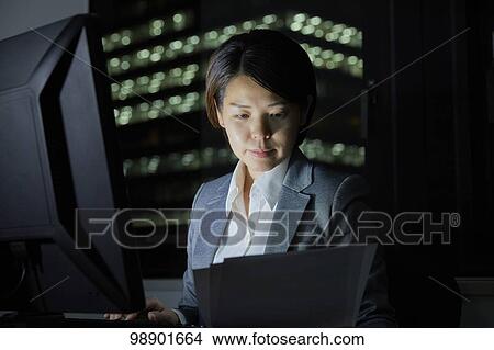 Japanese businesswoman working late at night View Large Photo Image Picture - Japanese businesswoman working late at night. Fotosearch