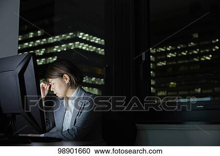 Japanese businesswoman working late at night View Large Photo Image Stock Image - Japanese businesswoman working late at night. Fotosearch