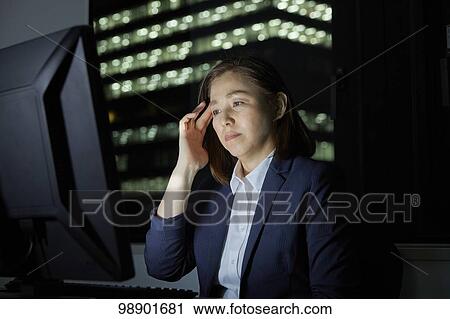 Japanese businesswoman working late at night View Large Photo Image Stock Image - Japanese businesswoman working late at night. Fotosearch
