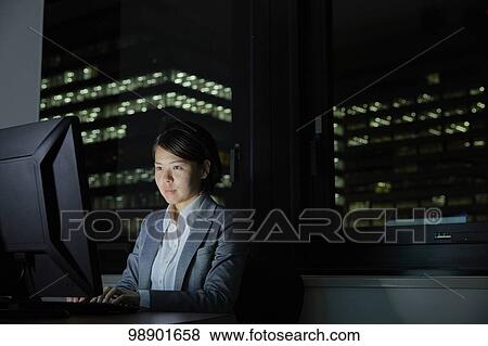 Japanese businesswoman working late at night View Large Photo Image Stock Photo - Japanese businesswoman working late at night. Fotosearch