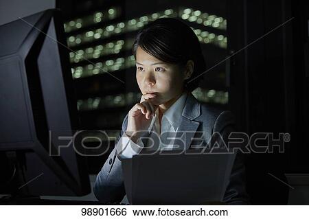 Japanese businesswoman working late at night View Large Photo Image Stock Photograph - Japanese businesswoman working late at night. Fotosearch