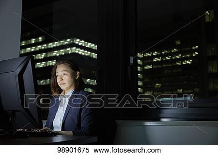 Japanese businesswoman working late at night View Large Photo Image Stock Photography - Japanese businesswoman working late at night. Fotosearch