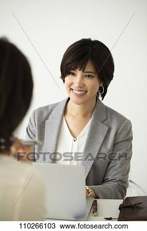Japanese businesswomen in the office View Large Photo Image Stock Image - Japanese businesswomen in the office. Fotosearch