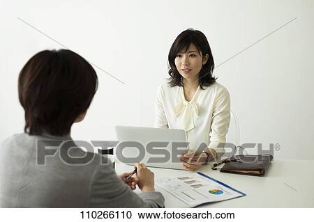 Japanese businesswomen in the office View Large Photo Image Stock Image - Japanese businesswomen in the office. Fotosearch
