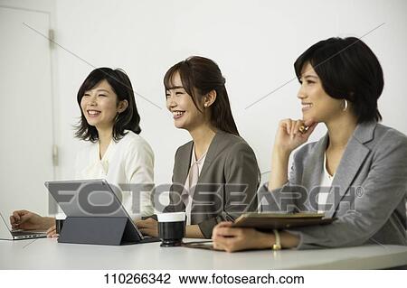 Japanese businesswomen in the office View Large Photo Image Stock Image - Japanese businesswomen in the office. Fotosearch