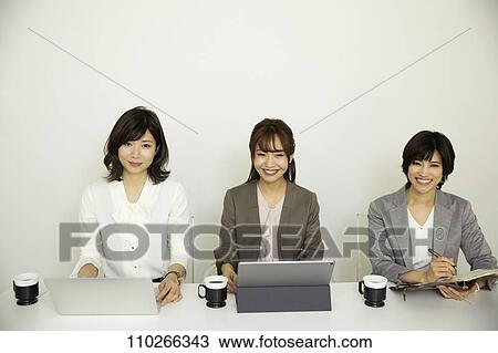 Japanese businesswomen in the office View Large Photo Image Stock Image - Japanese businesswomen in the office. Fotosearch
