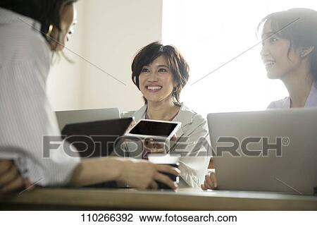 Japanese businesswomen in the office View Large Photo Image Stock Image - Japanese businesswomen in the office. Fotosearch