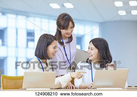 Japanese businesswomen in the office View Large Photo Image Stock Image - Japanese businesswomen in the office. Fotosearch