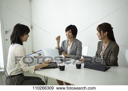 Stock Photo - Japanese businesswomen in the office. Fotosearch