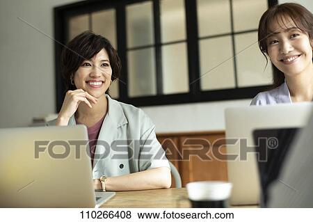 Japanese businesswomen in the office View Large Photo Image Stock Photo - Japanese businesswomen in the office. Fotosearch