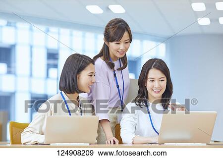 Japanese businesswomen in the office View Large Photo Image Stock Photo - Japanese businesswomen in the office. Fotosearch