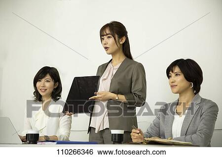 Stock Photograph - Japanese businesswomen in the office. Fotosearch