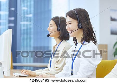 Stock Image - Japanese call center. Fotosearch