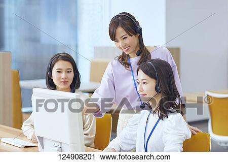 Stock Image - Japanese call center. Fotosearch