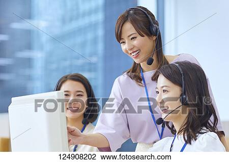 Stock Image - Japanese call center. Fotosearch