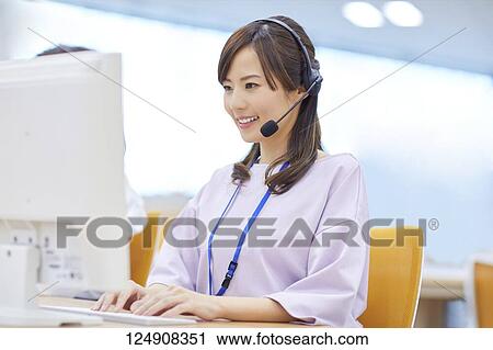 Stock Image - Japanese call center. Fotosearch
