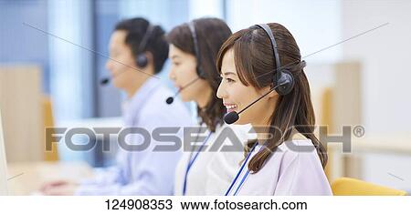 Stock Image - Japanese call center. Fotosearch