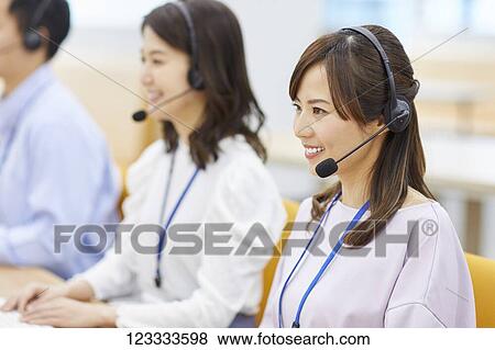 Japanese call center View Large Photo Image Stock Photo - Japanese call center. Fotosearch