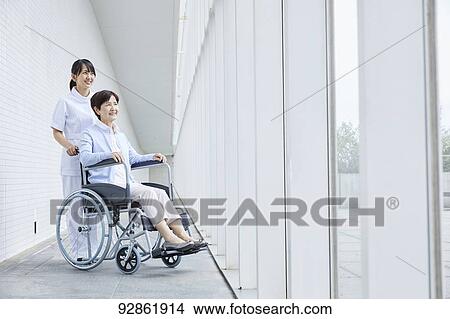 Japanese caretaker helping senior patient View Large Photo Image Picture - Japanese caretaker helping senior patient. Fotosearch