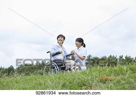 Japanese caretaker helping senior patient View Large Photo Image Picture - Japanese caretaker helping senior patient. Fotosearch