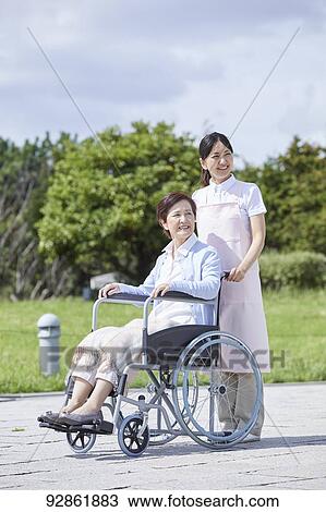 Japanese caretaker helping senior patient View Large Photo Image Stock Image - Japanese caretaker helping senior patient. Fotosearch