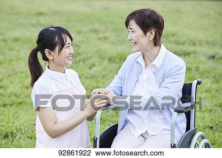 Japanese caretaker helping senior patient View Large Photo Image Stock Image - Japanese caretaker helping senior patient. Fotosearch