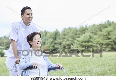 Japanese caretaker helping senior patient View Large Photo Image Stock Image - Japanese caretaker helping senior patient. Fotosearch