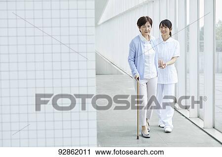 Japanese caretaker helping senior patient View Large Photo Image Stock Image - Japanese caretaker helping senior patient. Fotosearch