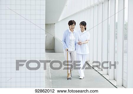 Japanese caretaker helping senior patient View Large Photo Image Stock Image - Japanese caretaker helping senior patient. Fotosearch