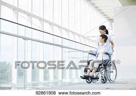 Japanese caretaker helping senior patient View Large Photo Image Stock Photo - Japanese caretaker helping senior patient. Fotosearch
