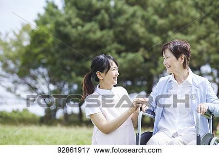 Japanese caretaker helping senior patient View Large Photo Image Stock Photo - Japanese caretaker helping senior patient. Fotosearch