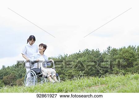 Japanese caretaker helping senior patient View Large Photo Image Stock Photo - Japanese caretaker helping senior patient. Fotosearch