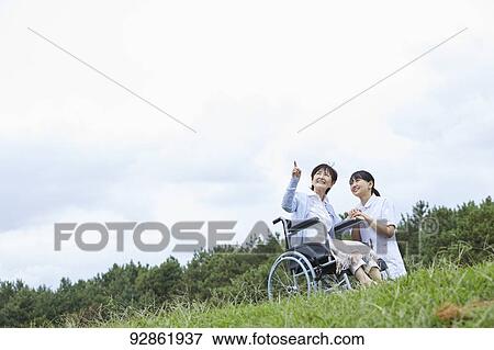 Japanese caretaker helping senior patient View Large Photo Image Stock Photo - Japanese caretaker helping senior patient. Fotosearch