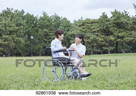 Japanese caretaker helping senior patient View Large Photo Image Stock Photo - Japanese caretaker helping senior patient. Fotosearch