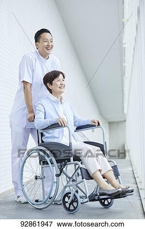 Japanese caretaker helping senior patient View Large Photo Image Stock Photo - Japanese caretaker helping senior patient. Fotosearch