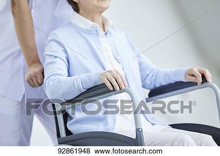 Japanese caretaker helping senior patient View Large Photo Image Stock Photo - Japanese caretaker helping senior patient. Fotosearch