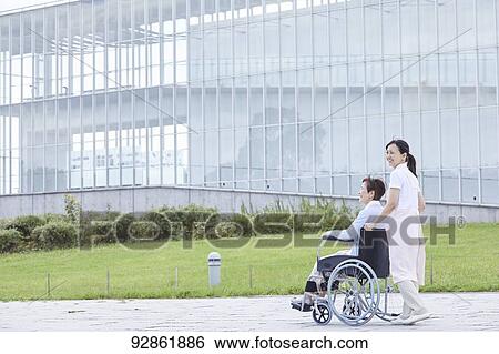 Japanese caretaker helping senior patient View Large Photo Image Stock Photograph - Japanese caretaker helping senior patient. Fotosearch
