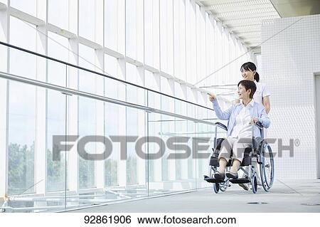 Japanese caretaker helping senior patient View Large Photo Image Stock Photograph - Japanese caretaker helping senior patient. Fotosearch