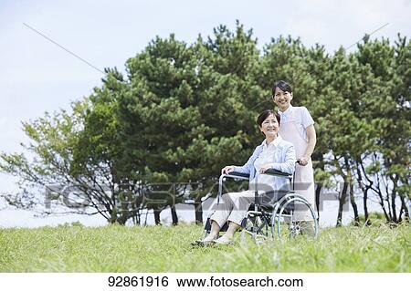 Japanese caretaker helping senior patient View Large Photo Image Stock Photograph - Japanese caretaker helping senior patient. Fotosearch