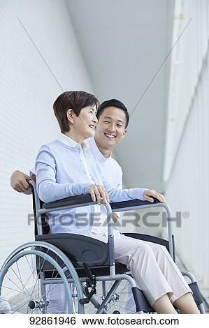 Japanese caretaker helping senior patient View Large Photo Image Stock Photograph - Japanese caretaker helping senior patient. Fotosearch