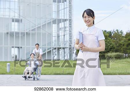 Japanese caretakers helping senior patient View Large Photo Image Stock Photo - Japanese caretakers helping senior patient. Fotosearch