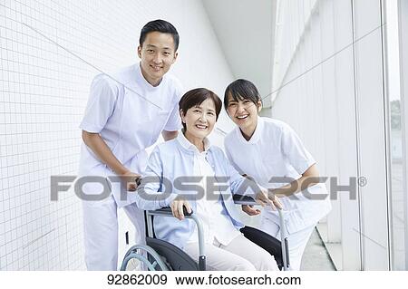 Japanese caretakers helping senior patient View Large Photo Image Stock Photo - Japanese caretakers helping senior patient. Fotosearch