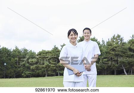 Stock Image - Japanese caretakers. Fotosearch