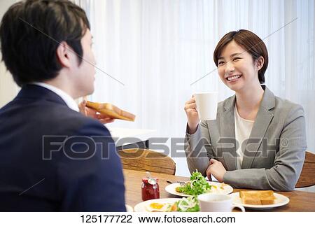 Stock Image - Japanese couple at home. Fotosearch