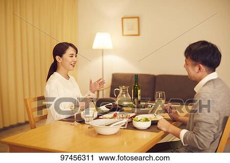 Stock Image - Japanese couple at home. Fotosearch